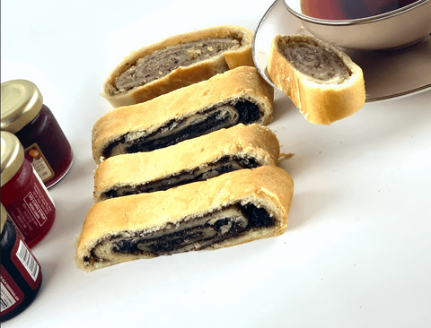 Poppy Seed Roll and Kolachi Cut up next to jams